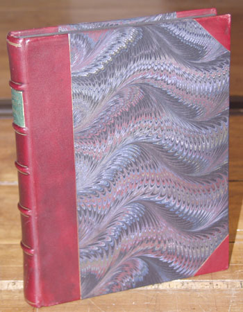 Three-quarter leather binding with marbled paper covers.