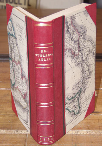 Three-quarter leather binding, with leather spine and corners.